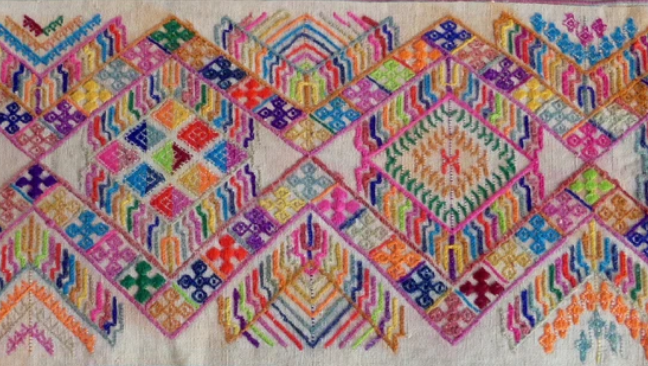 Colourful woven Bhutanese textile with geometric patterns