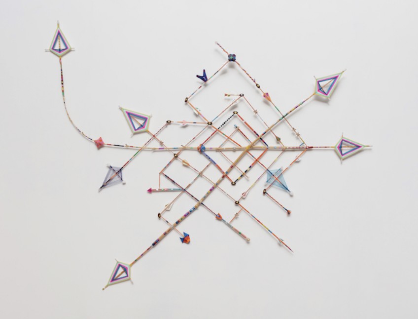 Wall assemblage of bamboo rods and small coloured Namkhar resembling a sky map
